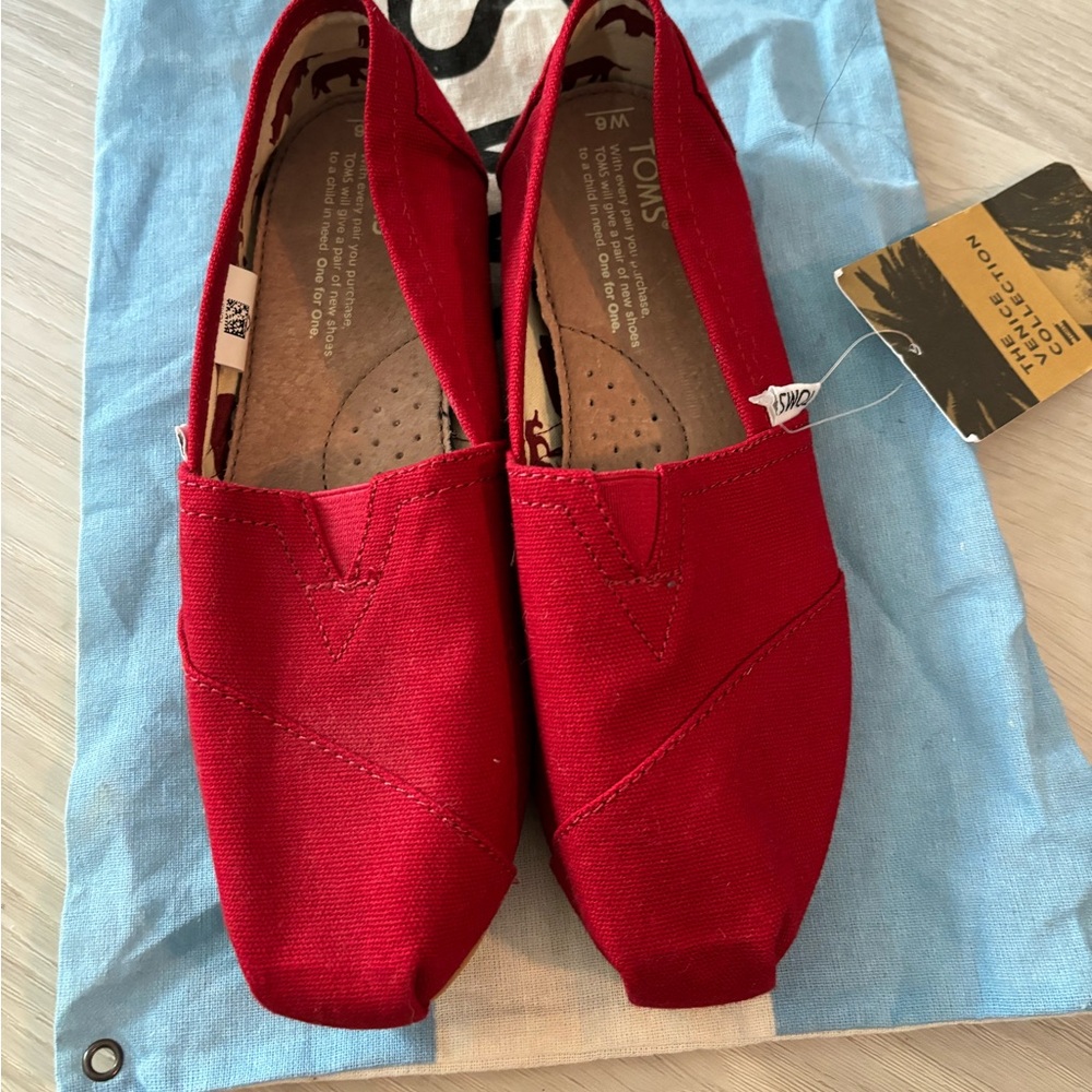 Brand new red TOMS size 6